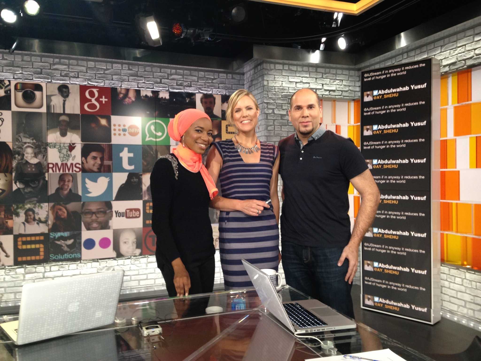 Sara Farley poses on set with The Stream hosts Malika Balil and Omar Baddar.